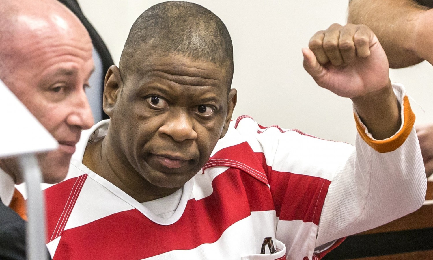 Rodney Reed waves to his family in Bastrop county district court in Bastrop, Texas, on 13 October 2017. Photograph: Ricardo Brazziell/AP