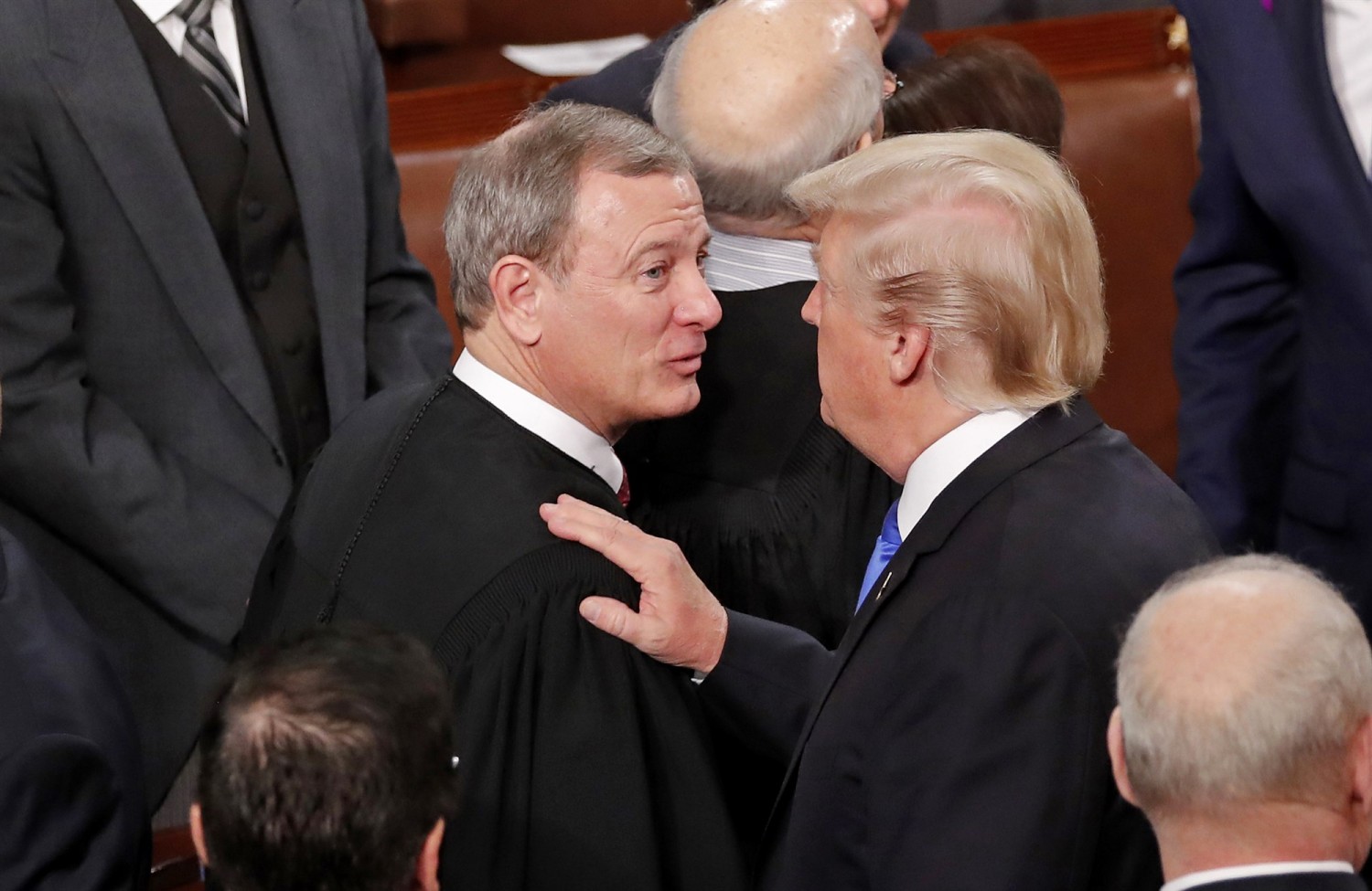 President Donald Trump talks with Chief Justice John Roberts as he departs after delivering his State of the Union address to a joint session of Congress in Washington in January 2018.Jonathan Ernst / Reuters file