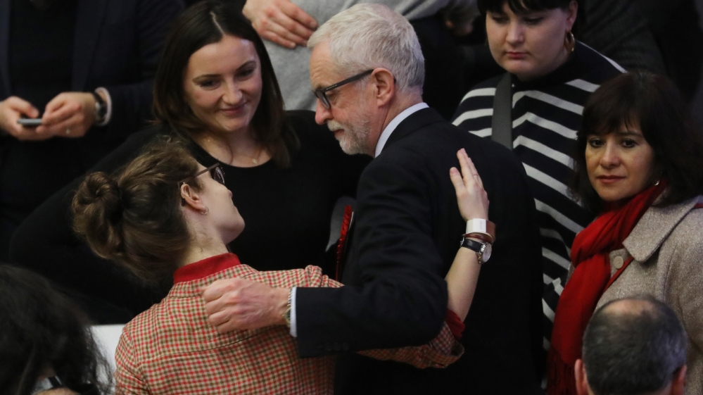 Britain's opposition Labour Party leader Jeremy Corbyn greets party agents and activists as he arrives at the count centre in Islington, north London, on December 13, 2019, to hear the results of the Islington North constituency race as part of the U