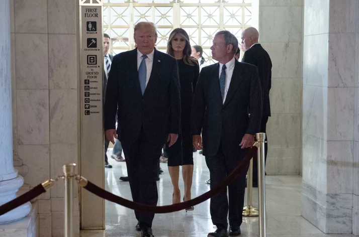 President Donald Trump and first lady Melania Trump arrive at the Supreme Court with Chief Justice John Roberts on July 22, 2019. Nicholas Kamm/AFP/Getty Images