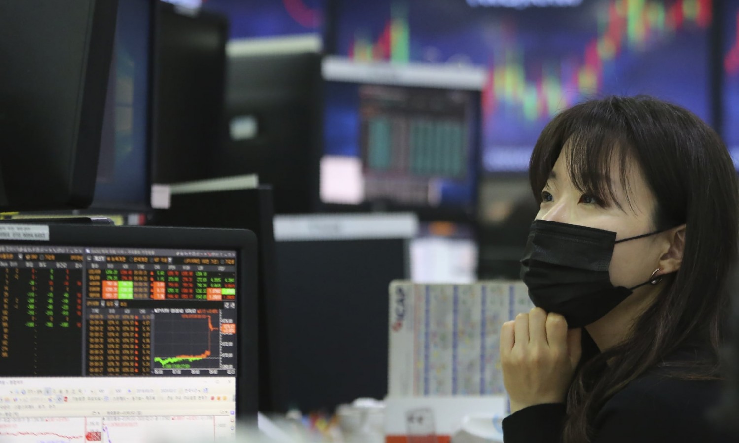 A currency trader in Seoul, South Korea. The plunging markets reflect growing fear over an unfolding economic catastrophe. Photograph: Ahn Young-joon/AP