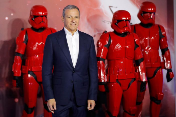 Disney CEO Bob Iger poses on the red carpet with sith stormtroopers upon arrival for the European film premiere of Star Wars: The Rise of Skywalker in London on December 18, 2019. (Photo by TOLGA AKMEN/AFP via Getty Images)
