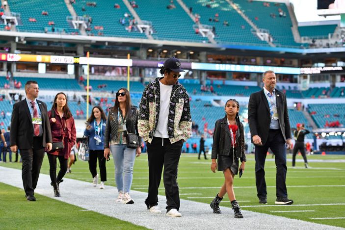 Jay-Z walks with his daughter Blue Ivy Carter as they tour the field before the start of Super Bowl LIV at Hard Rock Stadium in Miami Gardens, Fla., on Sunday, Feb. 2, 2020. (Photo: Jose Carlos Fajardo/MediaNews Group/The Mercury Ne
