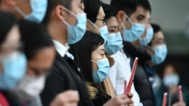 Local medical workers hold a strike near Queen Mary Hospital in Hong Kong. Picture: Anthony Wallace/AFPSource:AFP