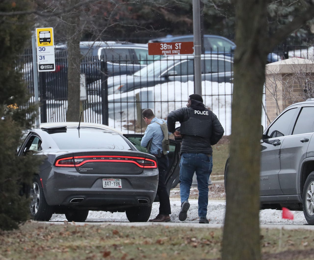 Police gear up on arrival on the Highland Blvd. side of Molson Coors corporate area as police respond to active shooter. MICHAEL SEARS / MILWAUKEE JOURNAL SENTINEL