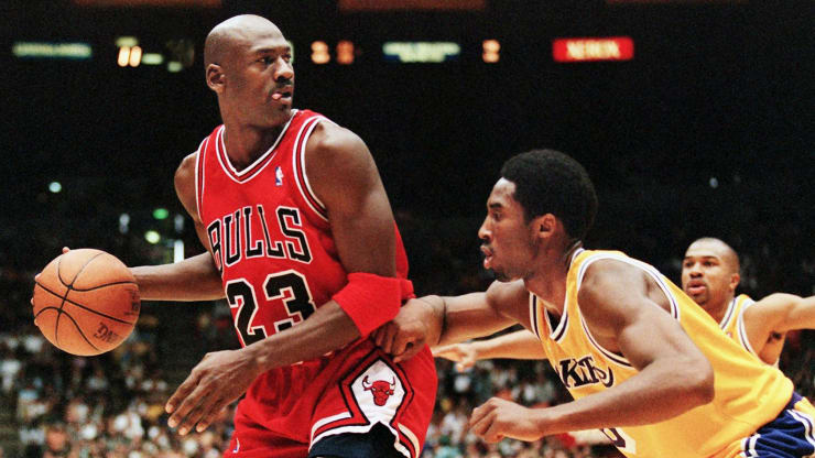 Michael Jordan of the Chicago Bulls (L) eyes the basket as he is guarded by Kobe Bryant of the Los Angeles Lakers during their 01 February game in Los Angeles, CA. Vince Bucci | AFP | Getty Images