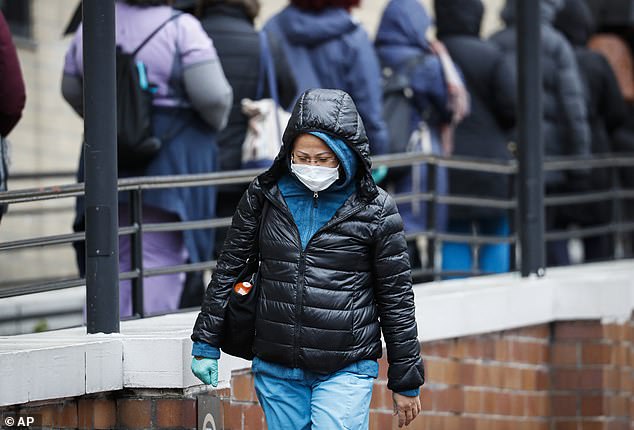 New York is now testing 16,000 people a day, but long lines of people waiting for the test can still be seen outside facilities like the Veterans Affairs Medical Center (pictured)