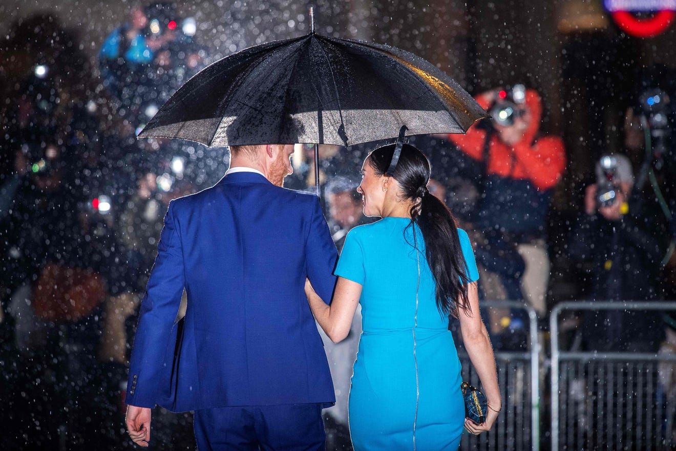 Prince Harry and Duchess Meghan were greeted by a crowd of shouting reporters as they arrived at the Endeavour Fund Awards at Mansion House in London on March 5, 2020. Notice how long Meghan's hair has grown since she was last photographed in London.