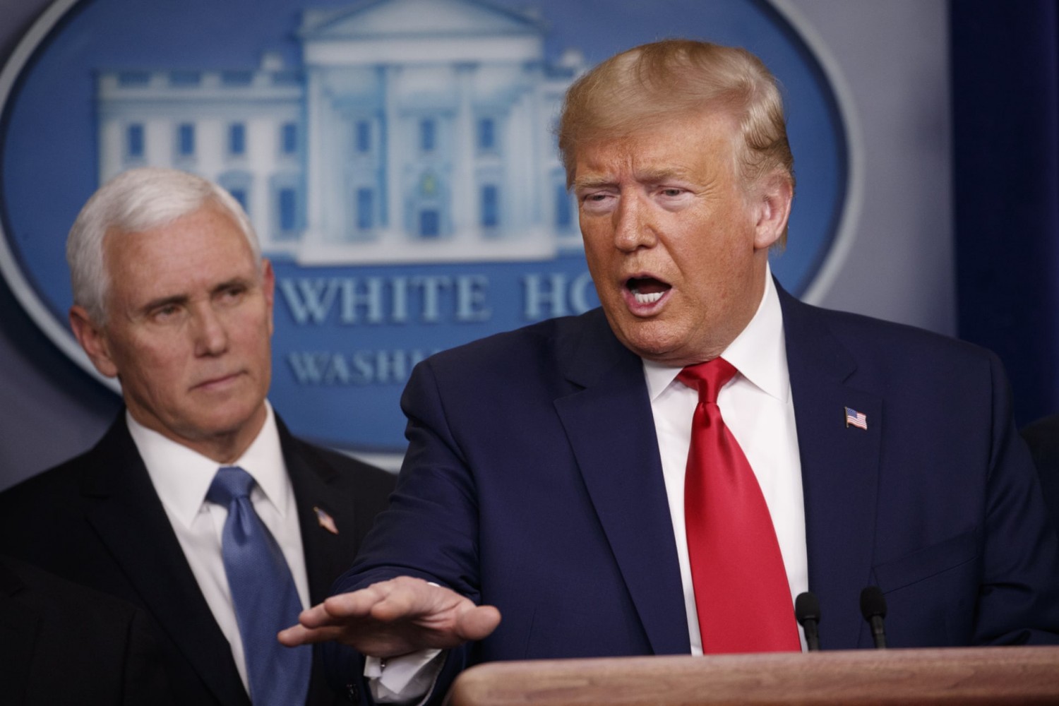 Trump with Mike Pence at the White House. Experts warn that conflicting statements could complicate public health officials’ response to the crisis. Photograph: Carolyn Kaster/AP