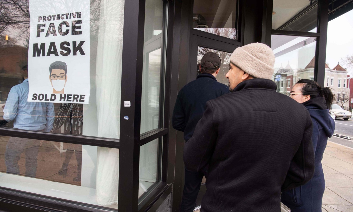 Customers queue to enter a coronavirus pop-up store in Washington DC, on 6 March 2020. Photograph: Nicholas Kamm/AFP via Getty Images