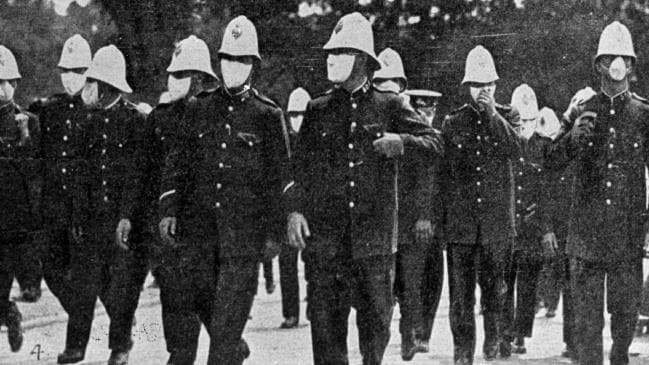 Police parade in masks during the Spanish flu epidemic in Sydney, Australia 1919.Source:News Limited