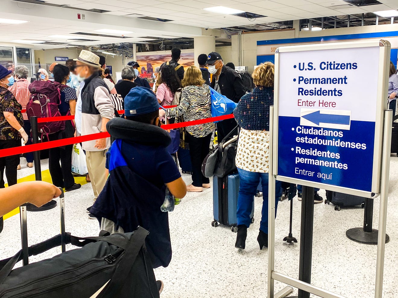 U.S. citizens line up to board a U.S. Immigration and Customs Enforcement aircraft to return to the county from Central America.