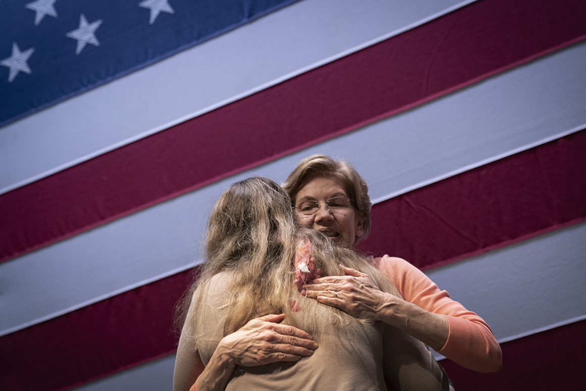 Former Democratic presidential candidate Elizabeth Warren embraces a supporter during a Charleston, S.C. rally in Feb. 2020. | Drew Angerer/Getty Images
