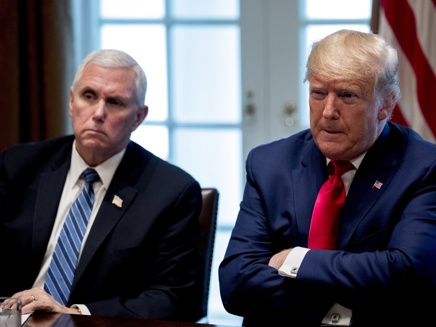 President Donald Trump and Vice President Mike Pence, left, attend a meeting with pharmaceutical executives on the coronavirus in the Cabinet Room of the White House on Monday. Andrew Harnik/AP