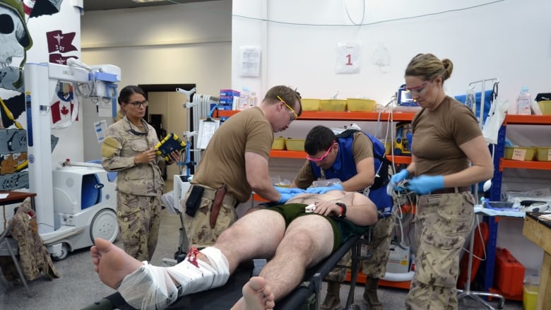 A Canadian Armed Forces medical technician works on a simulated patient during a training exercise at the Role 2 combat hospital in Iraq in November 2016. The Department of National Defence says units deployed overseas will have to rely on allies or host