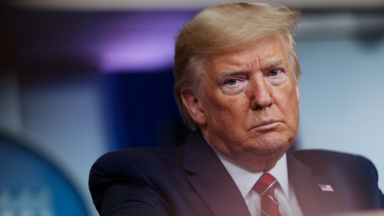 U.S. President Donald Trump reacts angrily to a question from an NBC News reporter asking what he would say to Americans who are feeling scared because of the COVID-19 crisis during a coronavirus task force briefing at the White House Friday. (Jonatha