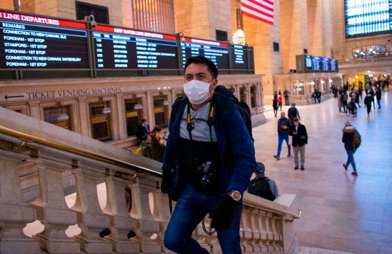 A man wears a face mask as he walks inside Grand Central Station in New York City on Mar. 8, 2020. Kena Betancur—AFP/Getty Images