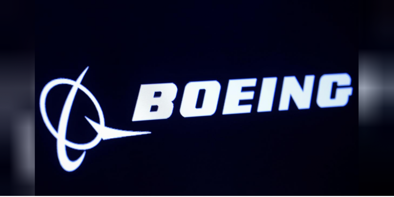 FILE PHOTO: The company logo for Boeing is displayed on a screen on the floor of the New York Stock Exchange (NYSE) in New York, U.S., March 11, 2019. REUTERS/Brendan McDermid/File Photo