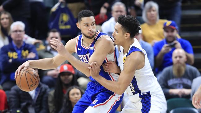 Ben Simmons dribbles the ball while defended by Malcolm Brogdon. (Photo by Andy Lyons/Getty Images)Source:Getty Images