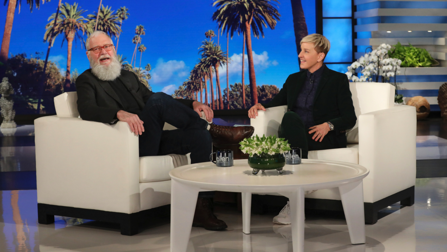 In this March 7, 2019 photo released by Warner Bros., David Letterman appears with host Ellen DeGeneres during a taping of "The Ellen DeGeneres Show" in Los Angeles.  (AP)