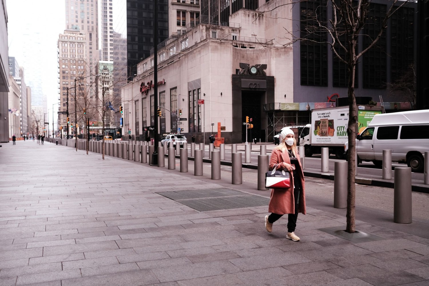 A woman walks down an empty street in Lower Manhattan on March 20 in New York City.  Spencer Platt/Getty Images