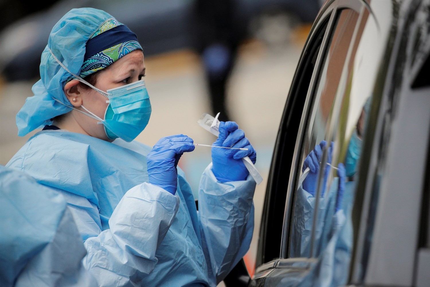 Image: Nurses work at a drive-thru testing site for the coronavirus disease (COVID-19) at North Shore University Hospital in Manhasset, New YorkNurses work at a drive-thru testing site for COVID-19 at North Shore University Hospital in Manhas