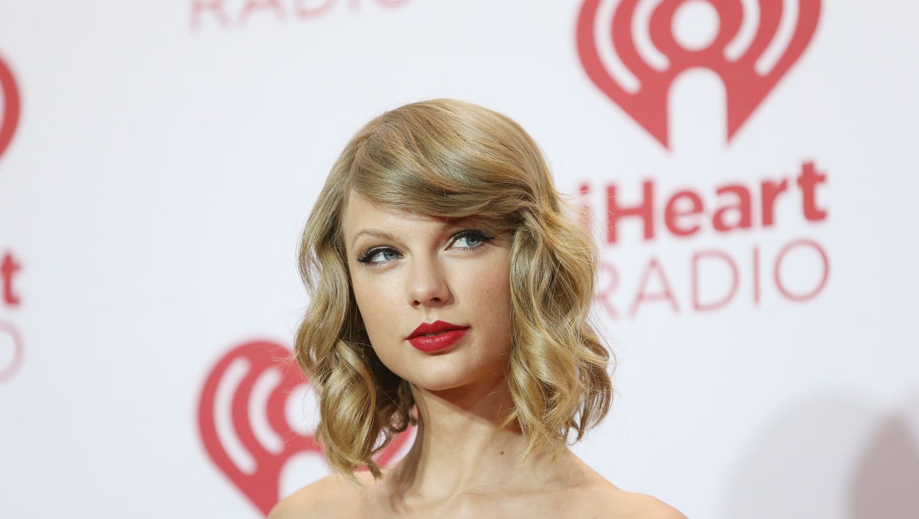 "Loose Curls and Side-swept Bangs" Taylor from 2014. Michael Tran, FilmMagic