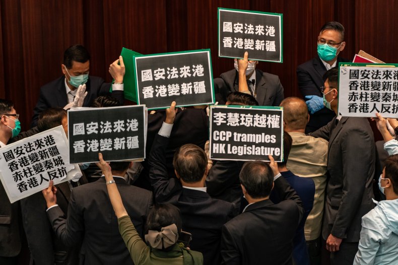 Pro-democracy lawmakers protest against pro-Beijing lawmakers at the Legislative Council on May 22, 2020 in Hong Kong, China. ANTHONY KWAN/GETTY IMAGES/GETTY