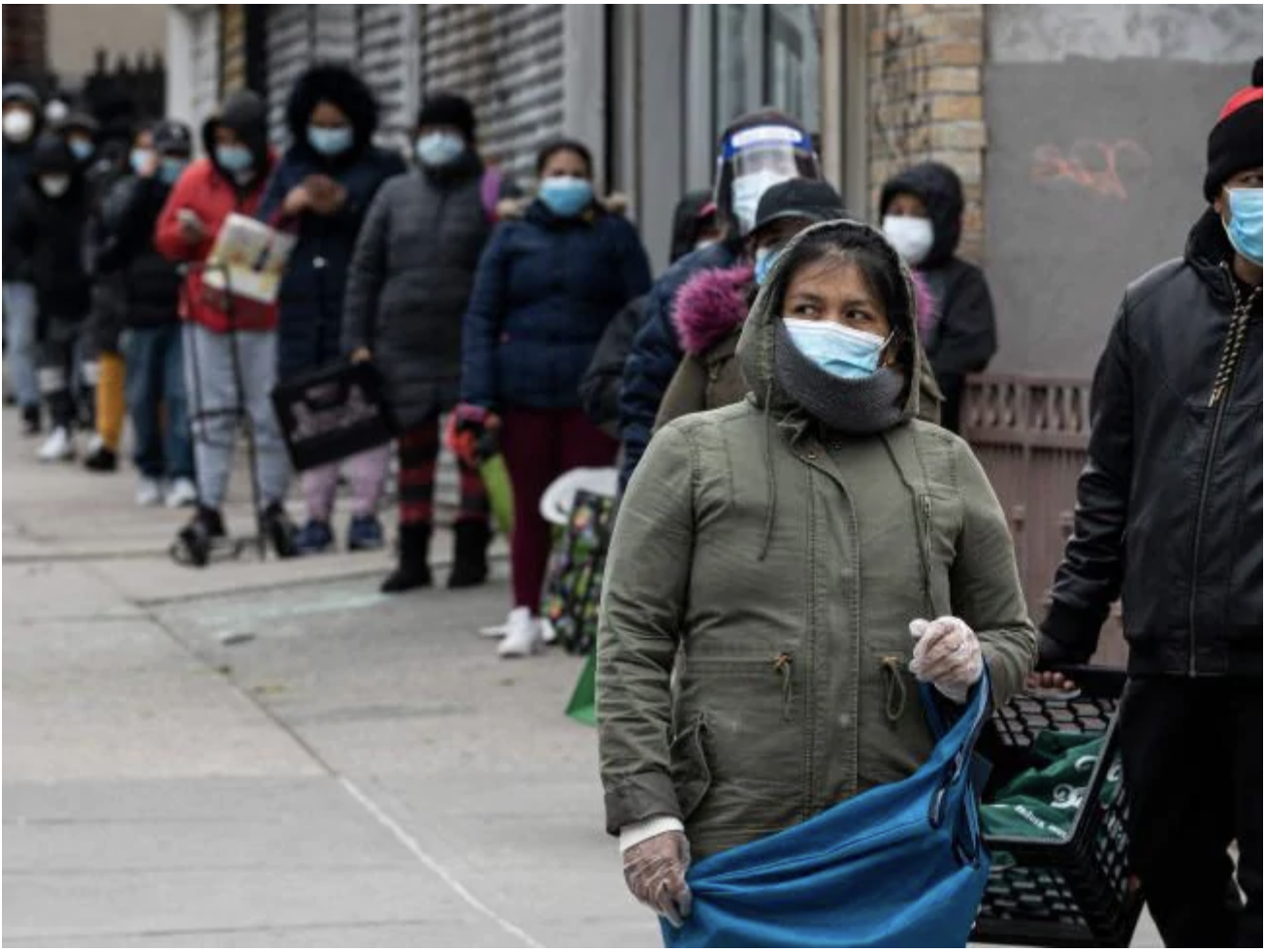 People in need line up at a food distribution centre organised by New York Assembly member Catalina Cruz and World Central Kitchen in the Corona neighbourhood of Queens amid the COVID-19 pandemic in New York City. Picture: Johannes EISELE / various sources / AFP.Source:AFP