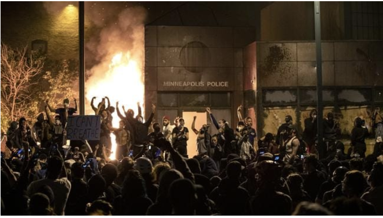  Protesters gesture after the Minneapolis police 3rd Precinct building was set on fire Thursday night, during demonstrations over the Monday death of George Floyd in Minneapolis police custody. Picture: APSource:AP