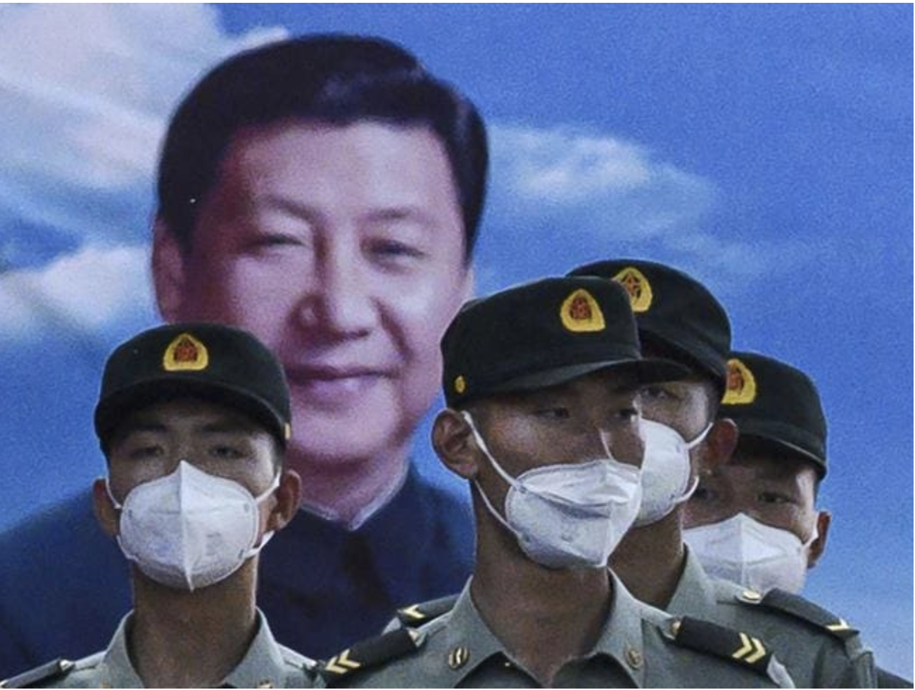 Soldiers of the People's Liberation Army's Honour Guard Battalion stand at attention in front of photo of China’s president Xi Jinping at their barracks outside the Forbidden City, near Tiananmen Square. Picture: Kevin Frayer / Getty Images Soldiers of the People's Liberation Army's Honour Guard Battalion stand at attention in front of photo of China’s president Xi Jinping at their barracks outside the Forbidden City, near Tiananmen Square. Picture: Kevin Frayer / Getty ImagesSource:Getty Images