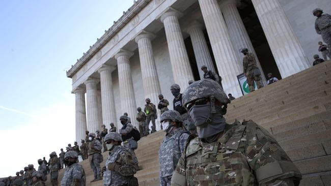 Members of the D.C. National Guard stand on the steps of the Lincoln Memorial as demonstrators participate in a peaceful protest against police brutality and the death of George Floyd in Washington, DC.Source:AFP