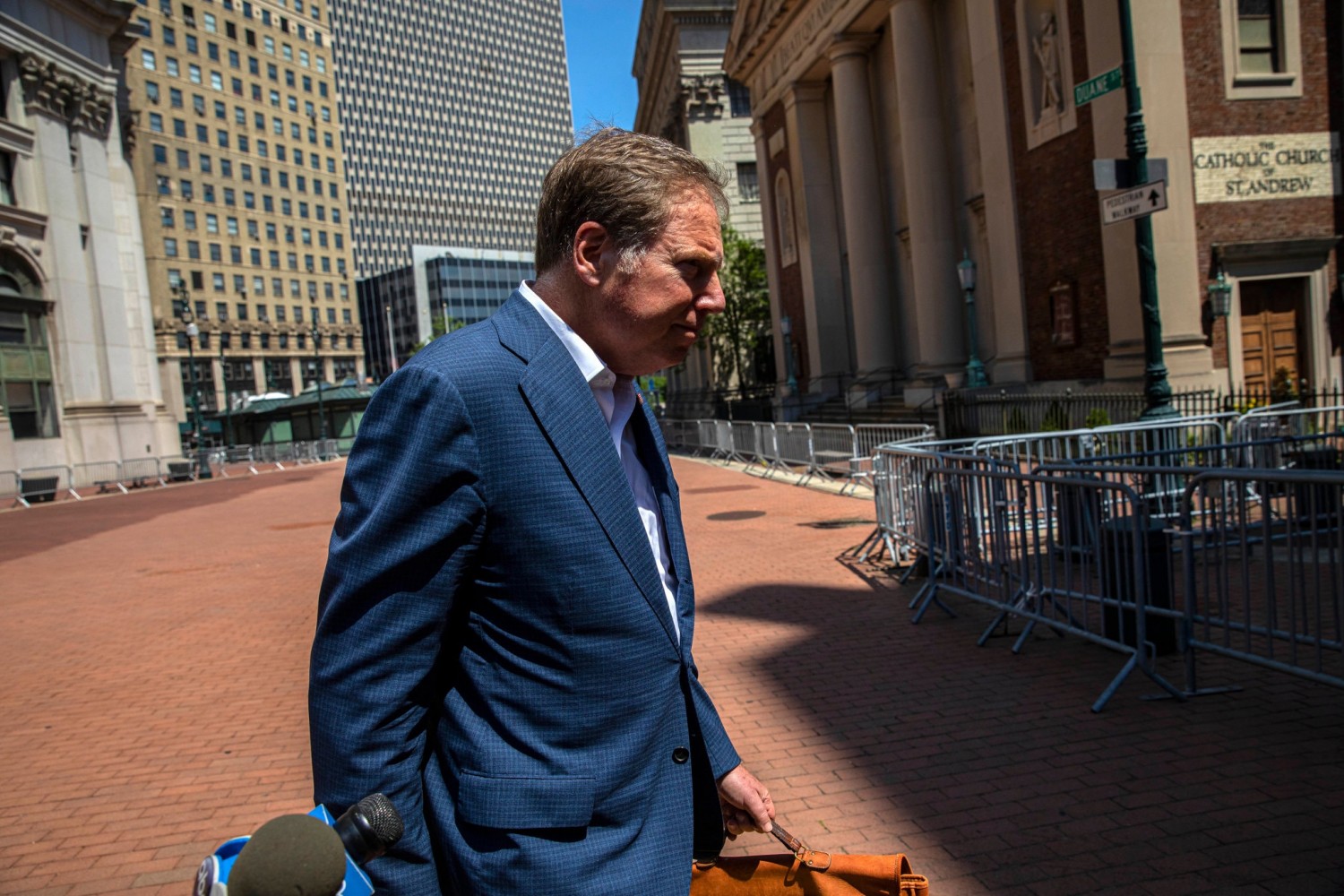 Geoffrey S. Berman, who refused to step down as the United States Attorney for the Southern District of New York, walks toward his offices in Lower Manhattan on Saturday.  Credit...Hiroko Masuike/The New York Times