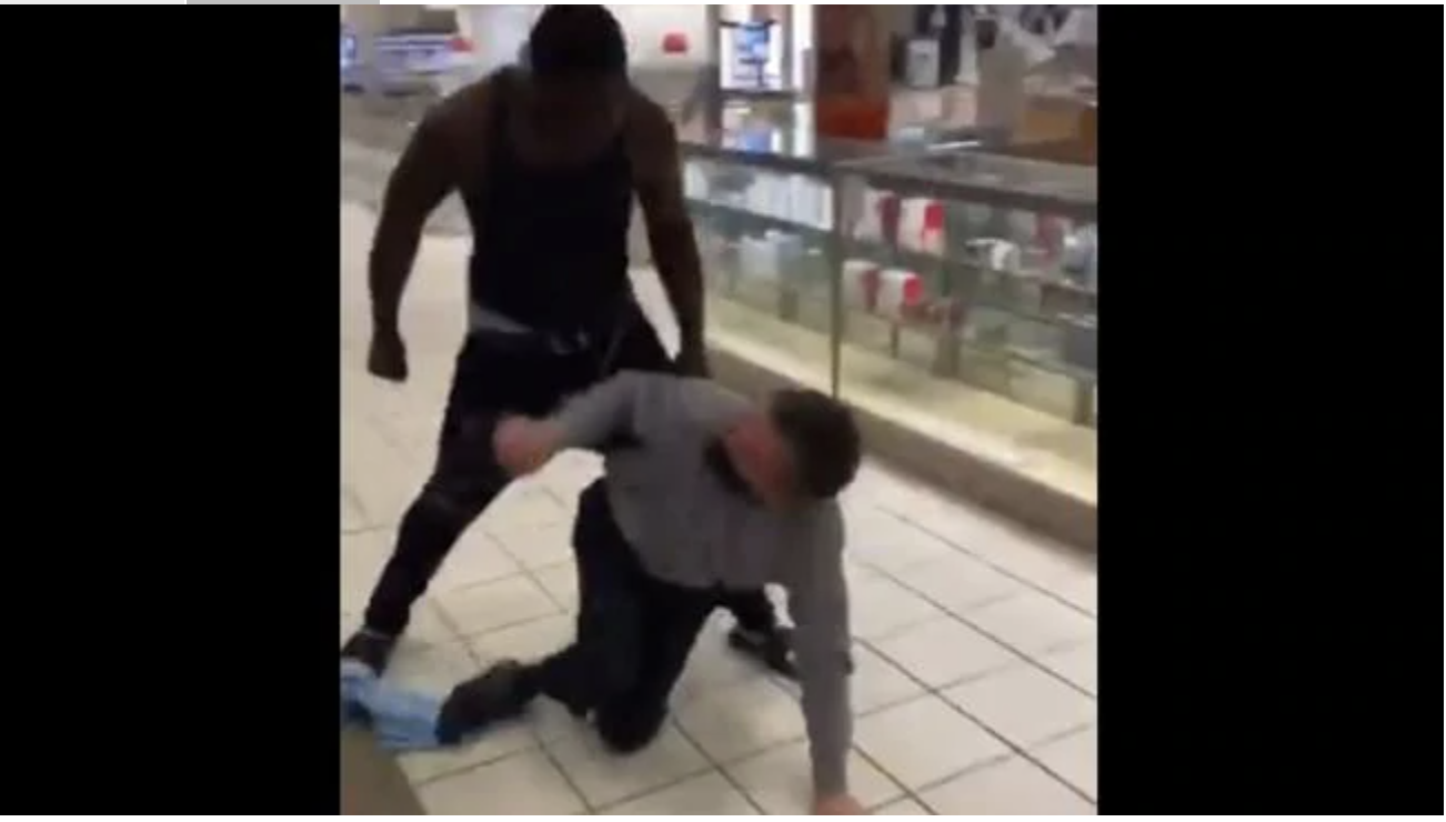 Video posted to Facebook shows an African-American man brutally bashing a white man inside a department store for allegedly using a racial slur while talking on the phone. Source: ft.quay.75/FacebookSource:Twitter