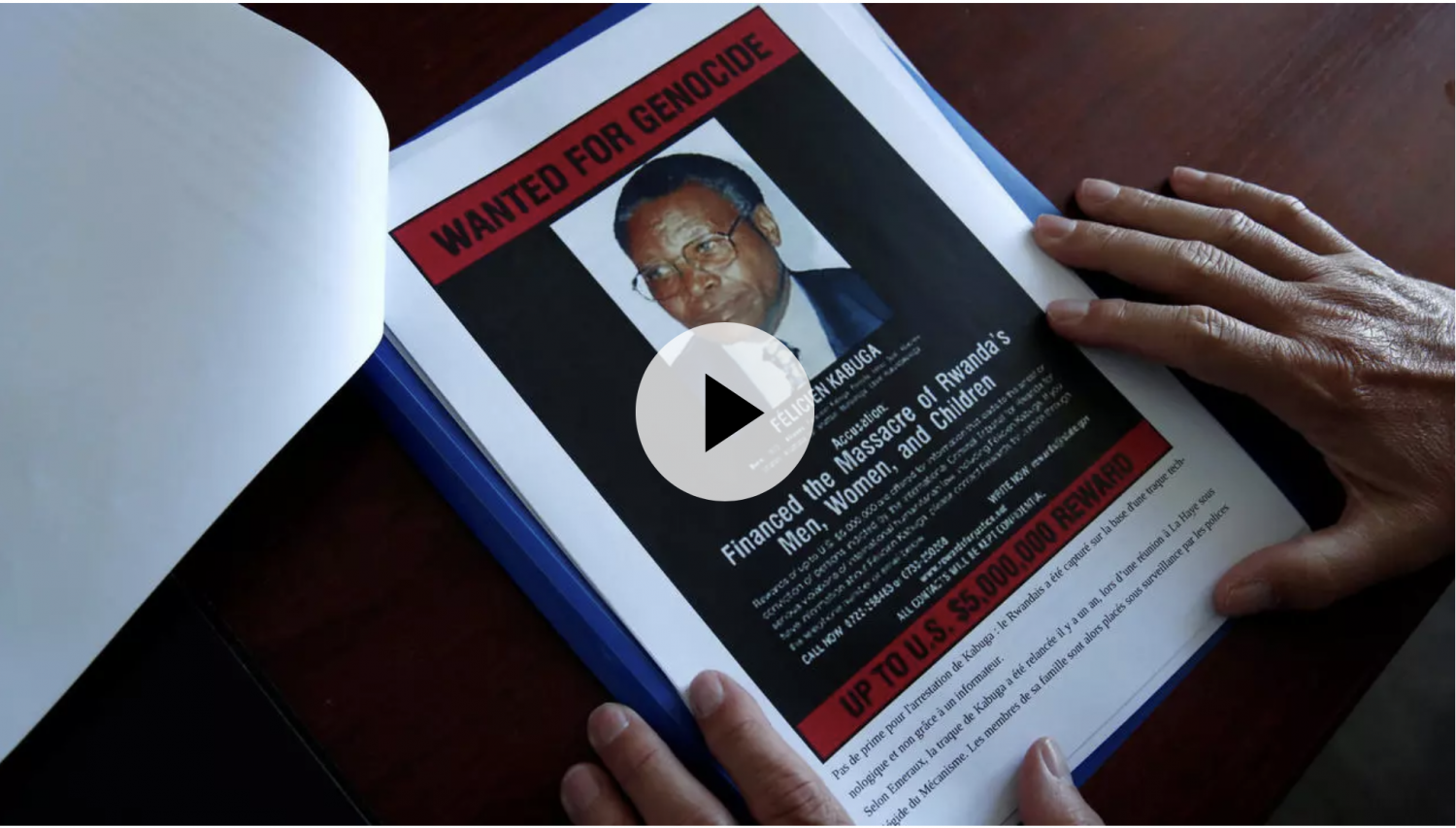A wanted poster with a photograph of Felicien Kabuga is displayed at the French Gendarmerie's Central Office for Combating Crimes Against Humanity, Genocides and War Crimes (OCLCH) in Paris on May 19, 2020. © Benoît Tessier, REUTERS