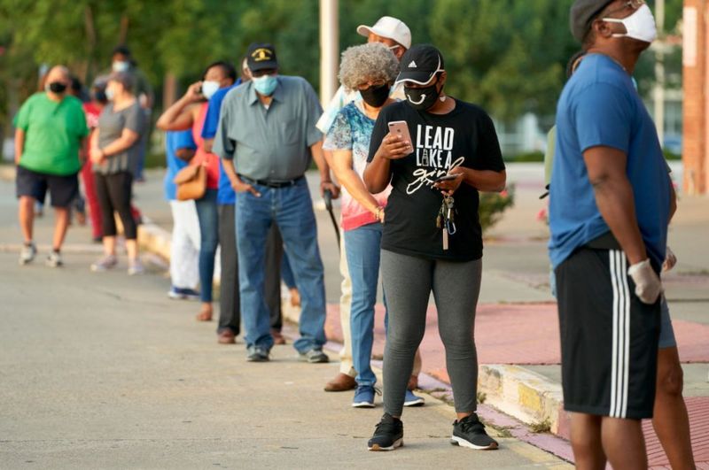 GETTY IMAGES / Some Texas voters got up early and still faced long lines on Tuesday
