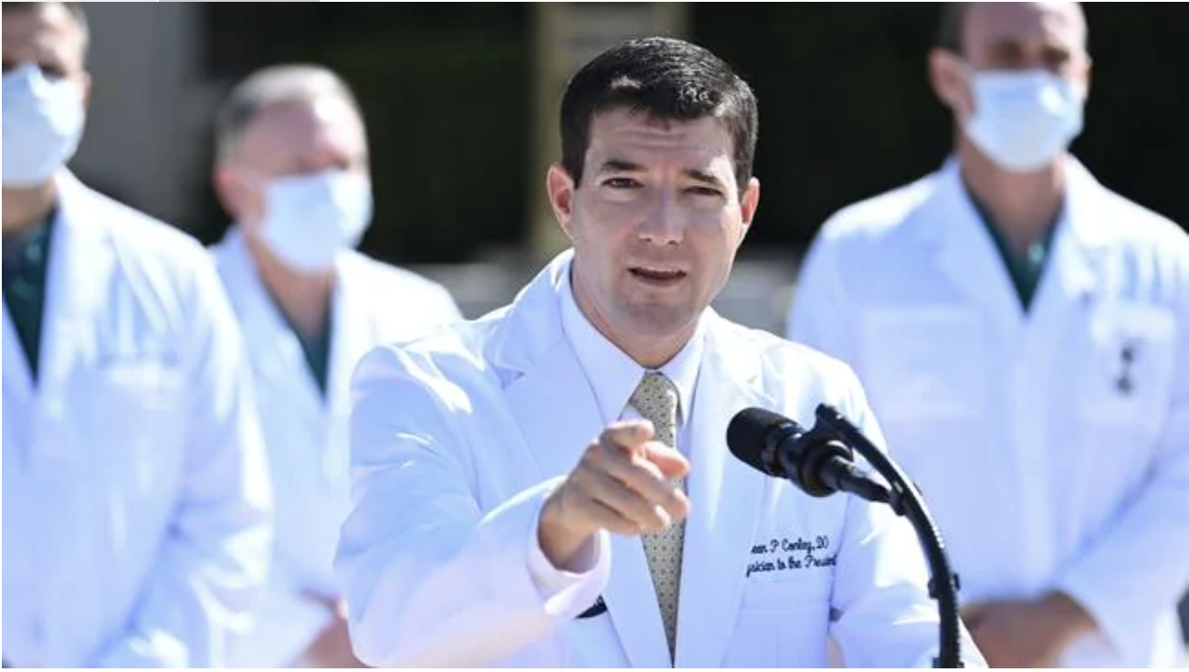 White House physician Sean Conley answers questions surrounded by other doctors. Picture: AFPSource:AFP