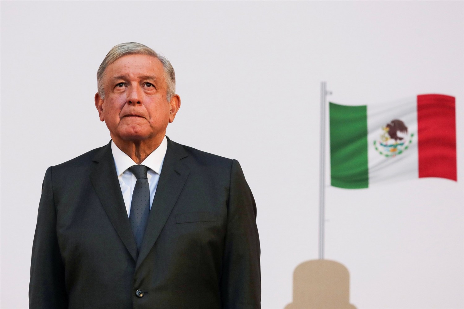 Andres Manuel Lopez Obrador listens to the national anthem after addressing the nation on his second anniversary as president in Mexico City on Dec. 1, 2020.Henry Romero / Reuter