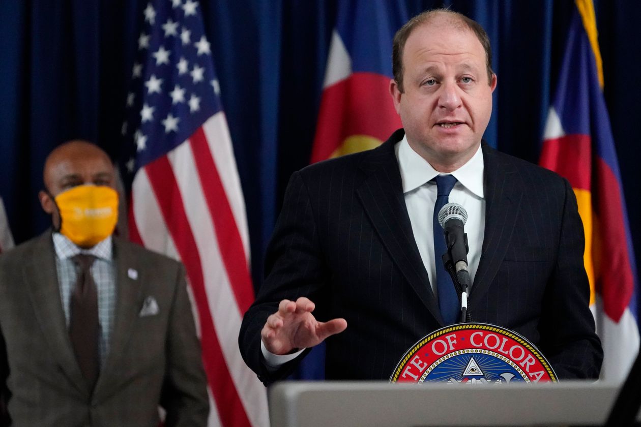 Colorado Gov. Jared Polis said Tuesday, ‘We are working to prevent spread and contain the virus at all levels.’ PHOTO: DAVID ZALUBOWSKI/ASSOCIATED PRESS