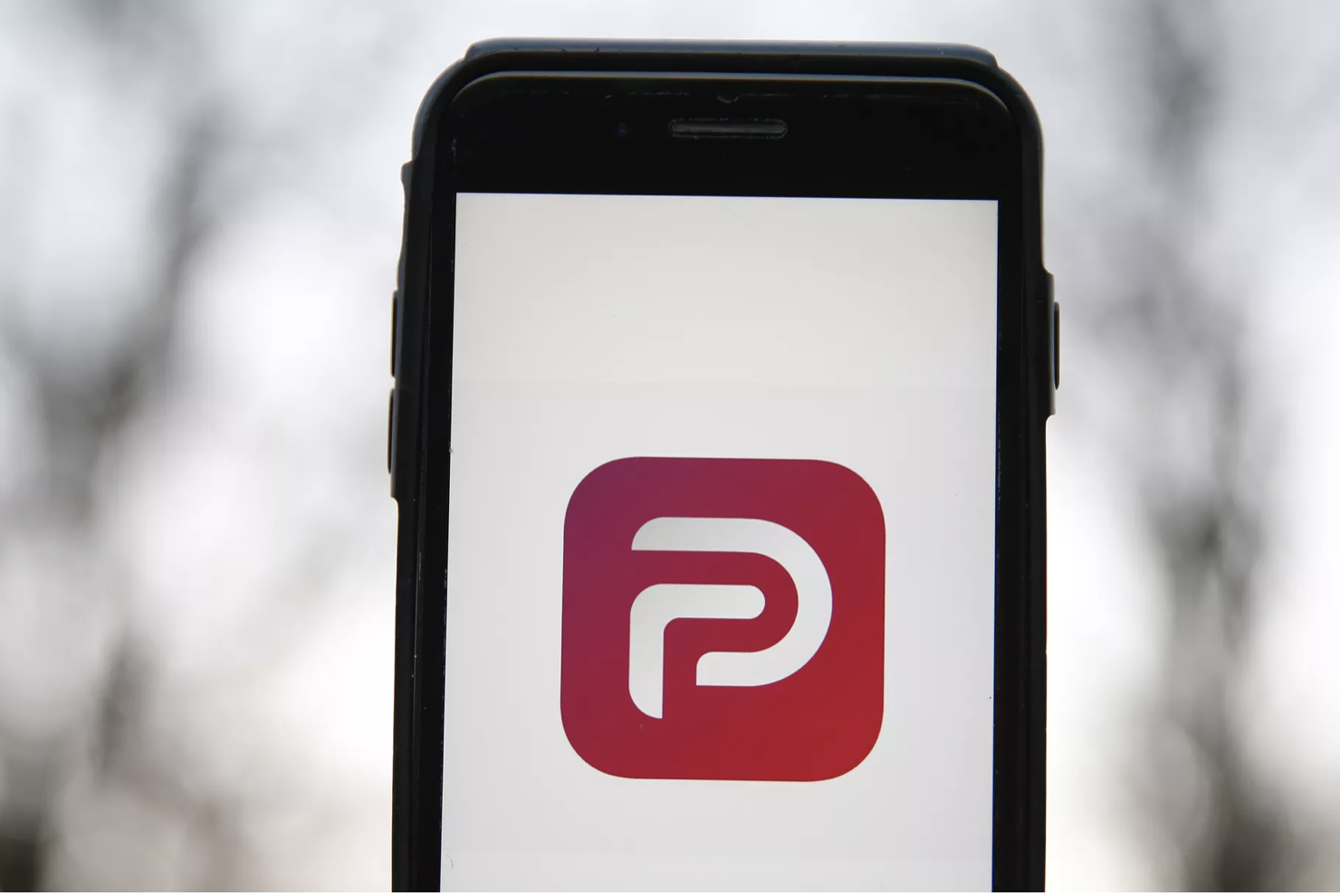 A general view of the the Parler app icon displayed on an iPhone. Hollie Adams/Getty Images