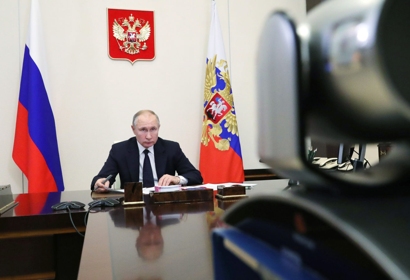 Russian President Vladimir Putin has discussed manufacturing the Sputnik V vaccine with German Chancellor Angela Merkel | Pool photo by Michail Klimentyev/Kremlin