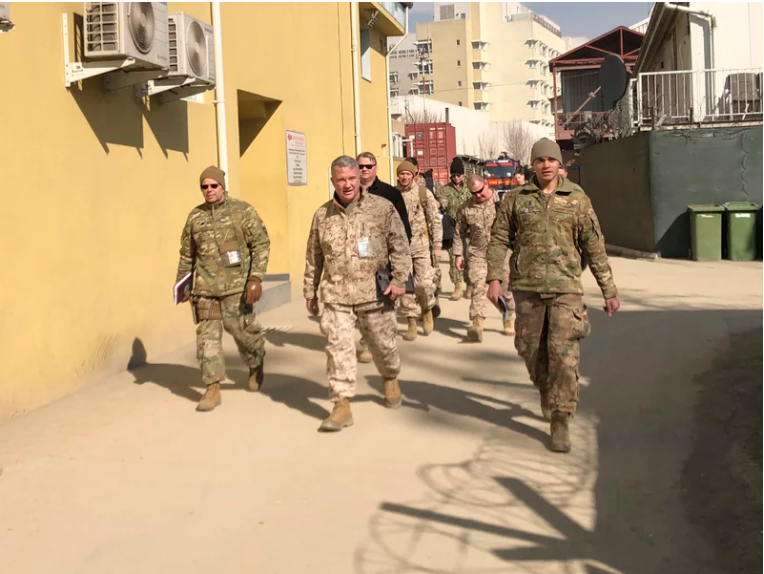 Marine Gen. Frank McKenzie (center) visits Kabul, Afghanistan, in January 2020. The Biden administration said it plans to complete a drawdown of U.S. troops in the country by Sept. 11. Lolita Baldor/AP