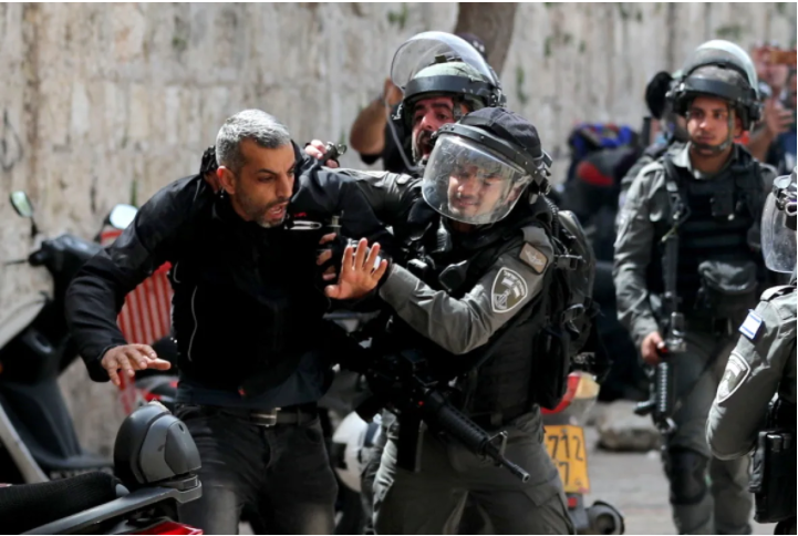 Israeli police detain a Palestinian during clashes at the compound that houses Al-Aqsa Mosque, known to Muslims as Noble Sanctuary and to Jews as Temple Mount, in Jerusalem's Old City on Monday. (Ammar Awad/Reuters)