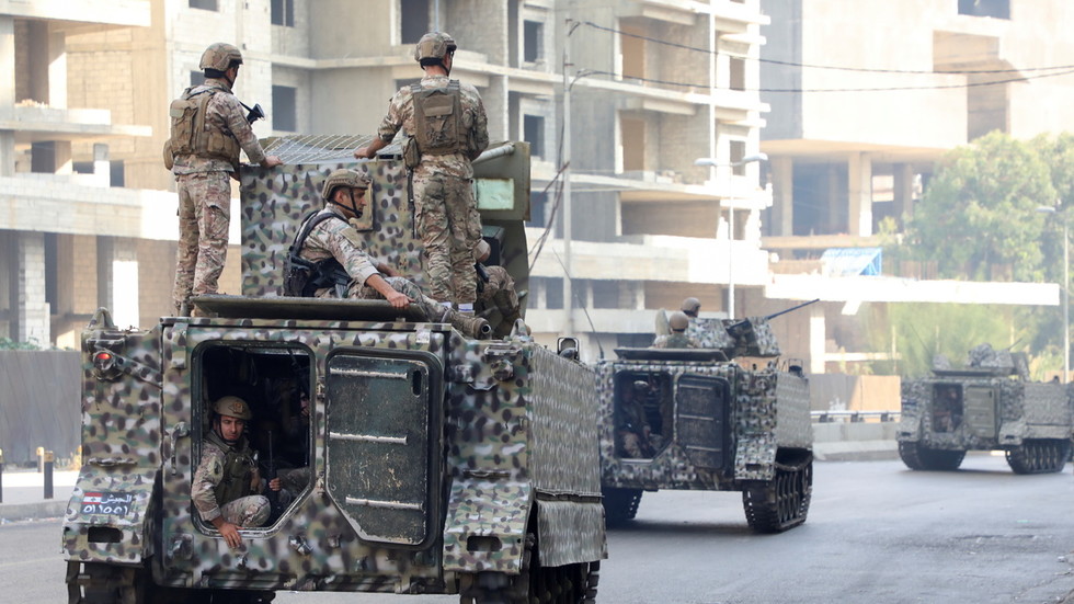 Troops fire from armored vehicles as Beirut descends into chaos, resembling warzone