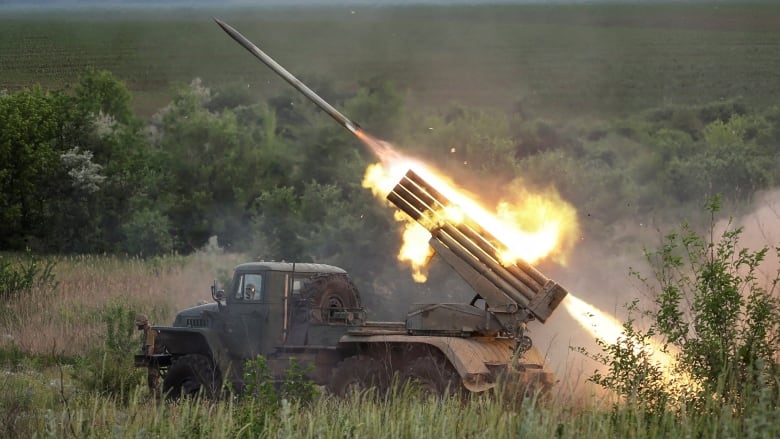 Ukrainian service members fire a BM-21 Grad multiple rocket launch system near the town of Bakhmut, Donetsk region in Ukraine on June 12, 2022. (Gleb Garanich/Reuters)