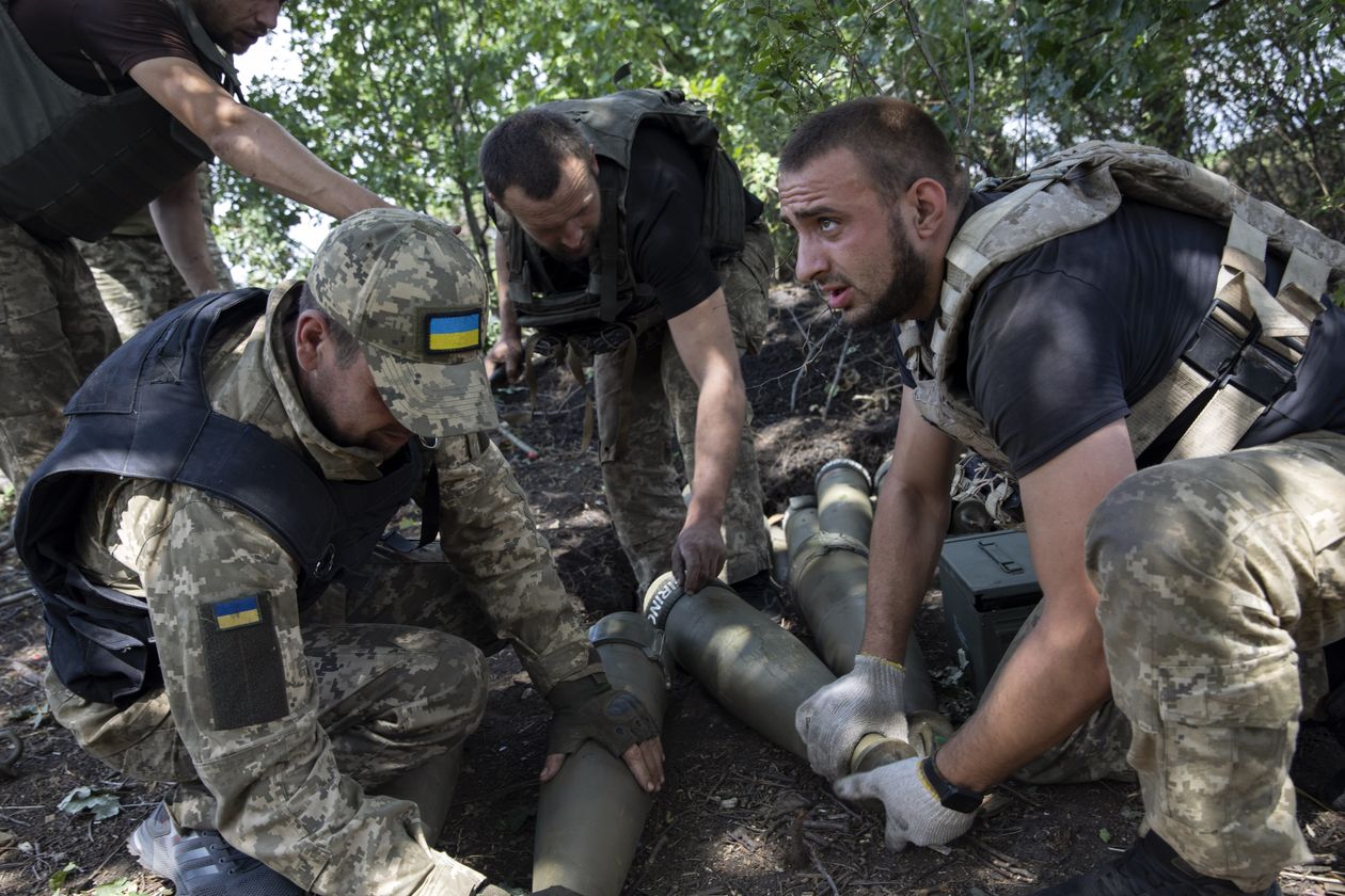 Ukrainian soldiers from the 40th Separate Artillery Brigade prepare 155 mm shells for a Western-supplied M777 howitzer.