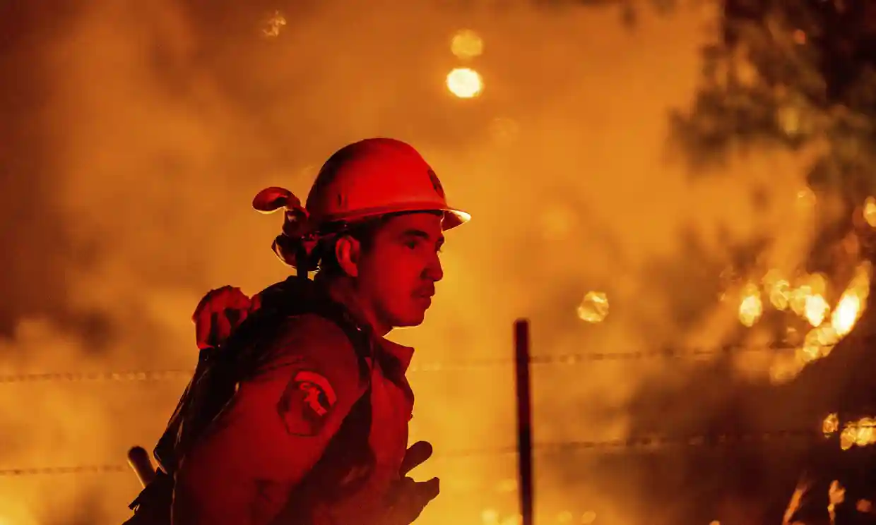 Rafael Soto battles the Electra fire burning in the Rich Gulch community of Calaveras County, California, on Tuesday. Photograph: Noah Berger/AP