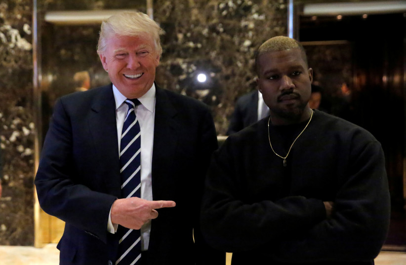 Then US-president elect Donald Trump and musician Kanye West pose for media at Trump Tower in Manhattan, New York City, US, December 13, 2016. (photo credit: REUTERS/ANDREW KELLY)