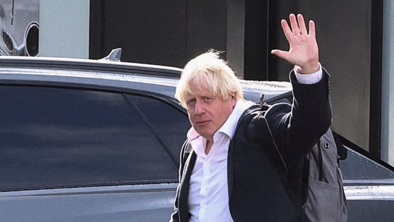 Former British prime minister Boris Johnson is seen at Gatwick Airport near London on Saturday. (Henry Nicholls/Reuters)