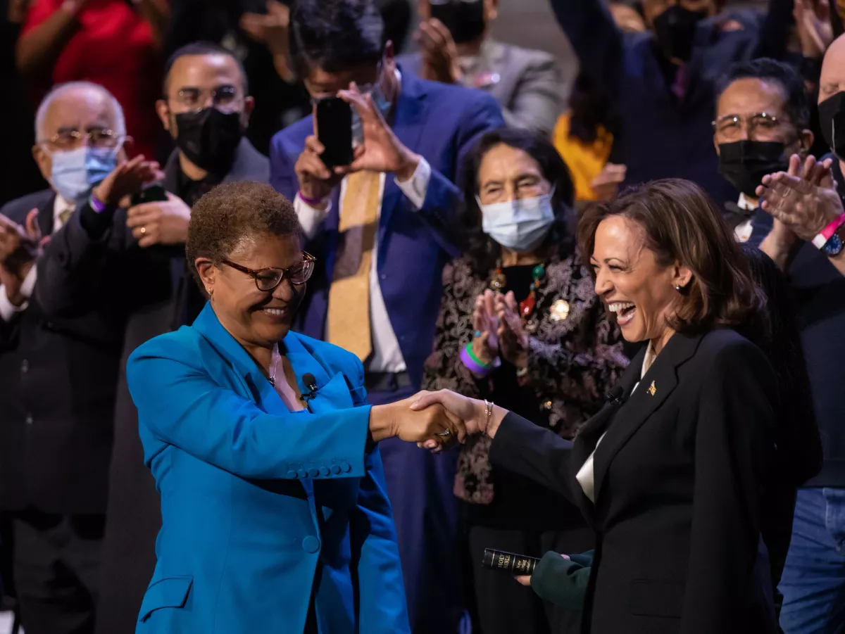 Los Angeles Mayor Karen Bass shakes hands with Vice President Kamala Harris following the oath of office during inauguration ceremonies Sunday at Microsoft Theater.(Myung J. Chun / Los Angeles Times)